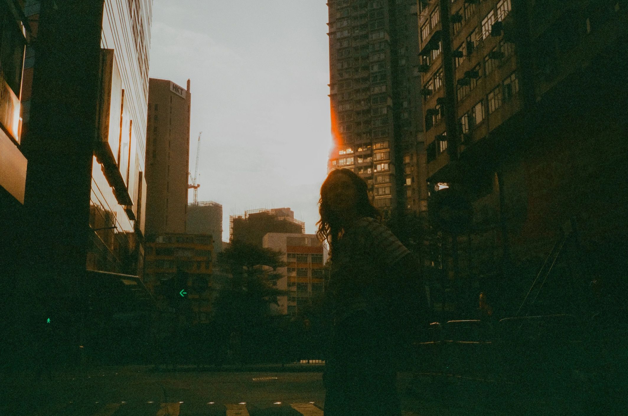 Mother and baby girl taking a selfie near a historic tower, cherishing travel memories together.